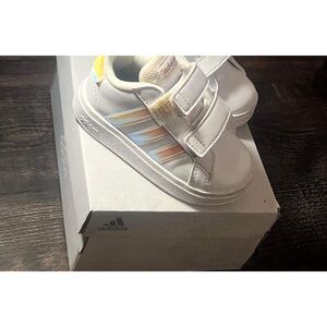 Brand: Adidas
Color: White with iridescent stripes
Condition:Fair